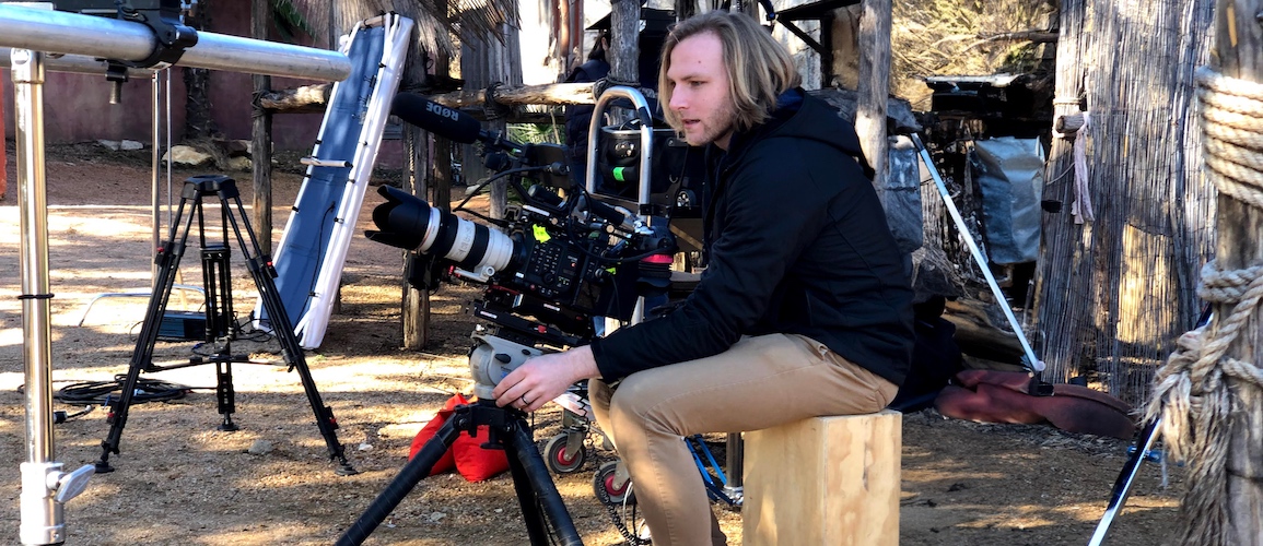 Dylan Bates working with a camera during a shoot