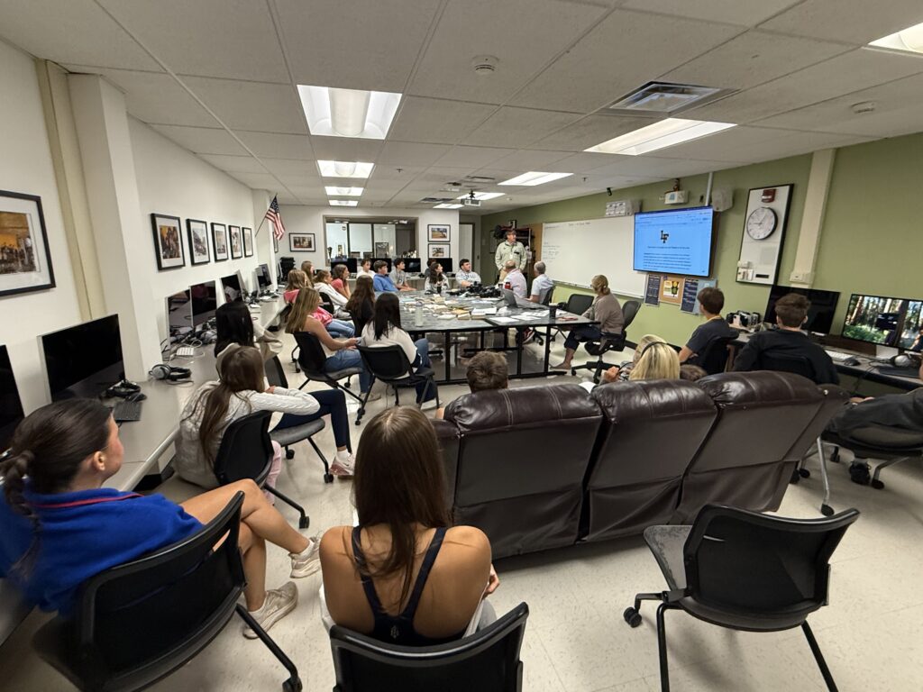 New Media Classroom, students gathered to learn.